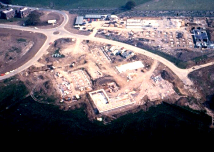 Aerial view of a building site in a photo from 1983