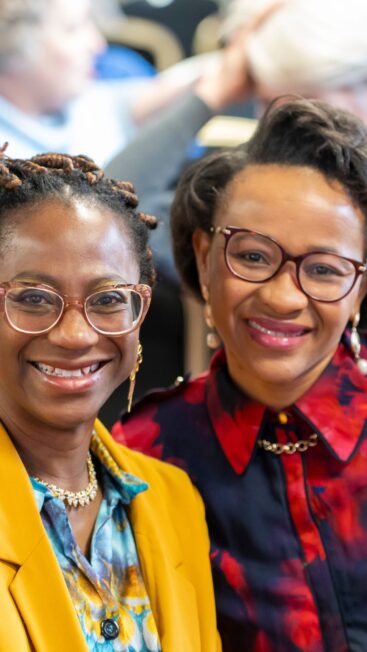 Two women smiling at the camera