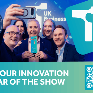 A group of winners pose for a photograph on a poster advertising the UK Business Tech Awards 2026