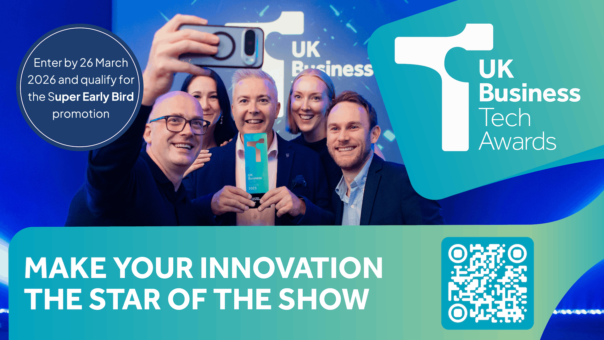 A group of winners pose for a photograph on a poster advertising the UK Business Tech Awards 2026